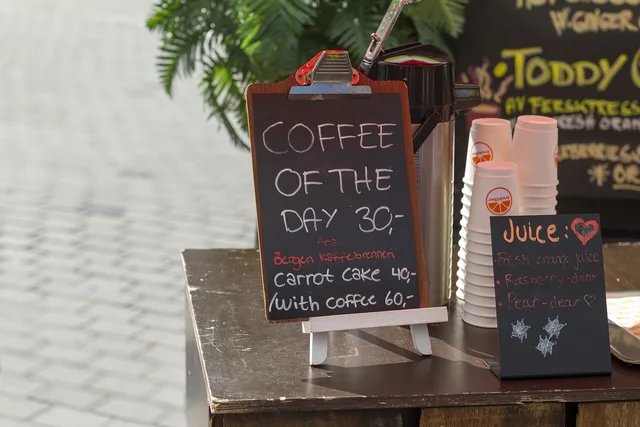 business, work, coffee, shop, chalkboard, menu, thermos, cups, nature, table, plants, concrete, floor, still. Food Truck Customer Acquisition: A Practical Guide